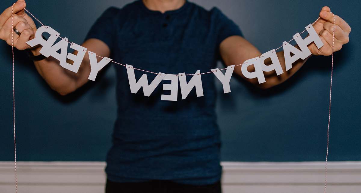 new year person holding happy new year decor 2020
